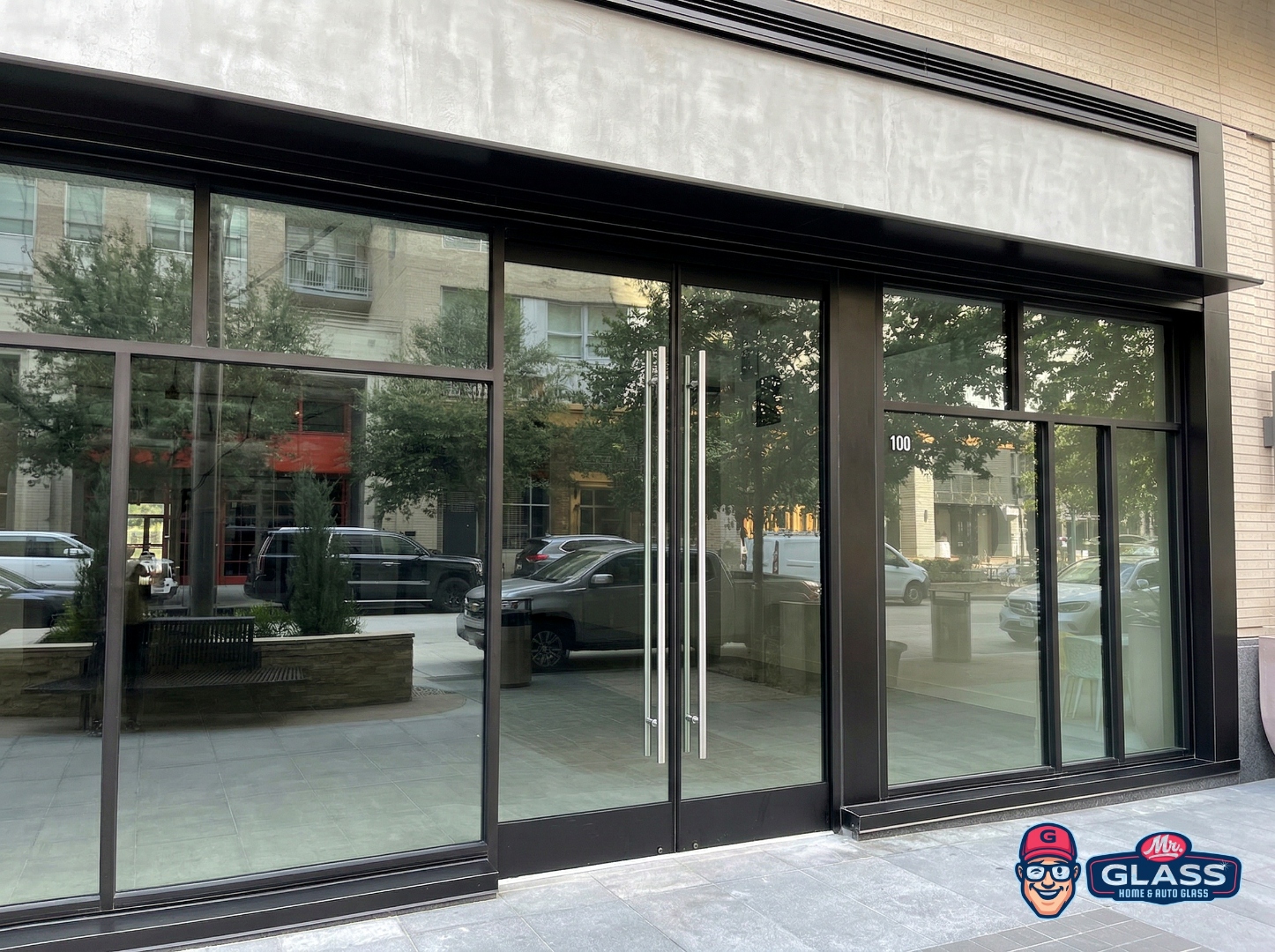 Commercial storefront with black-frame glass entry system