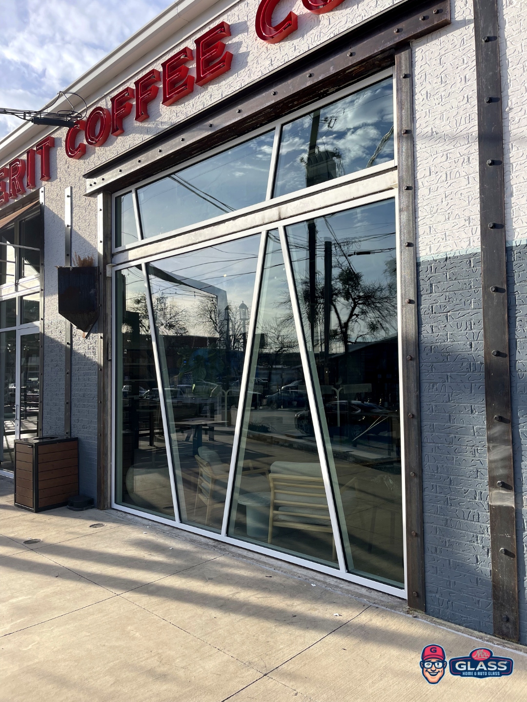 Merit Coffee storefront with full glass facade installation